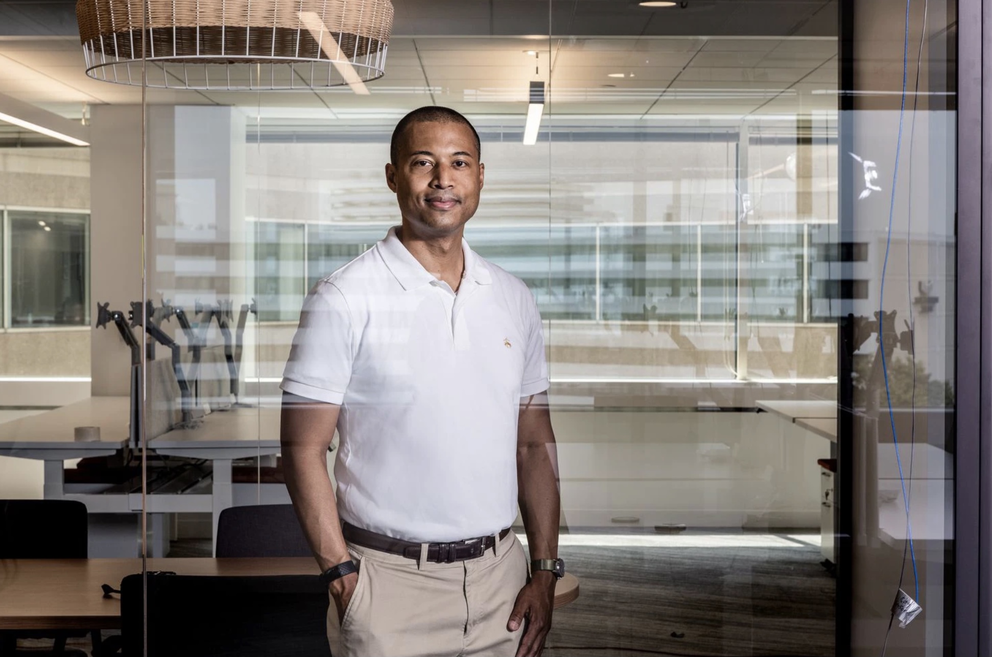 Alix Guerrier, CEO of GlobalGiving, stands in the nonprofits new headquarters after months of working from home