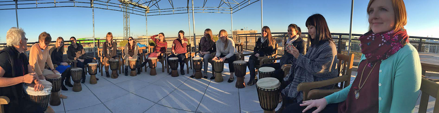 GlobalGiving staff at a drumming circle